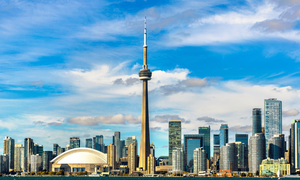 Skyline view of downtown Toronto featuring the CN Tower, included in the Historic Canada bus tour.