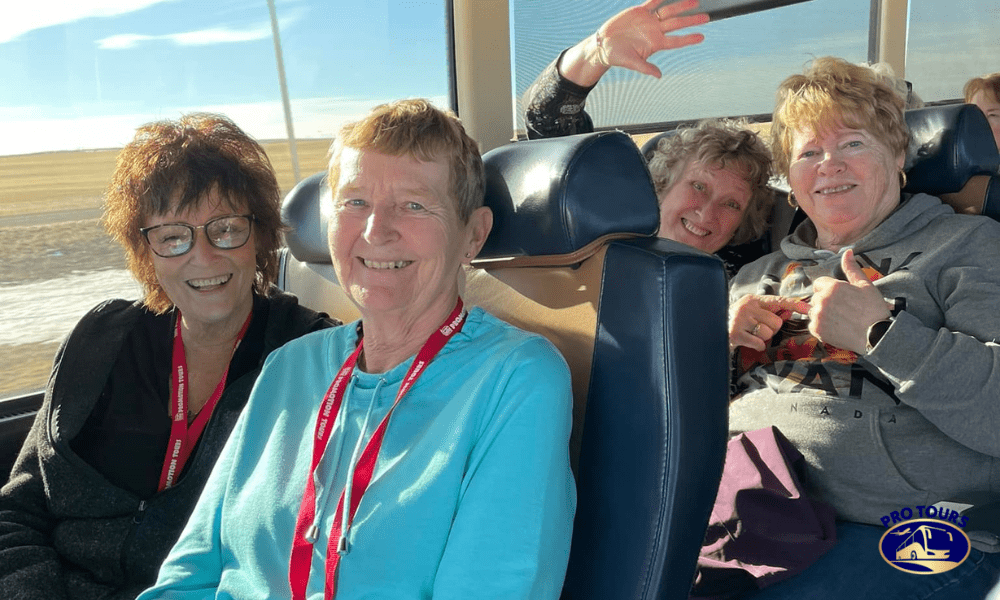 Happy travelers enjoying comfortable seating on a guided bus tour from Edmonton