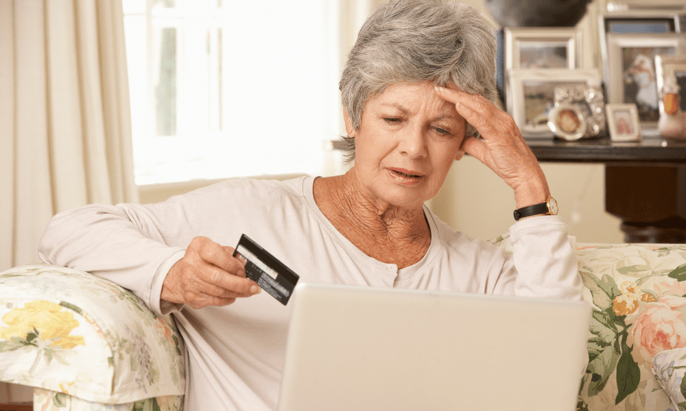 Senior traveler stressed by the hidden costs of planning independent travel