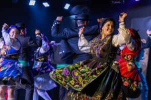 Folk dancers in colourful traditional clothing performing at the Folklorama Festival in Winnipeg