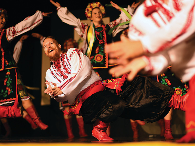 Traditional folk dancers performing in embroidered costumes at Winnipeg’s Folklorama Festival